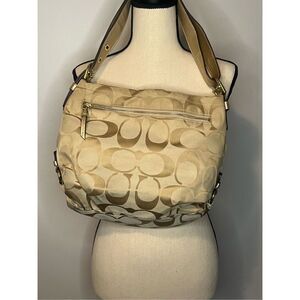 Tan and gold coach monogram purse